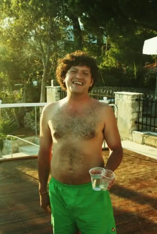 happy man on wooden decking villa